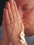 542421-FB~Woman-Praying-with-Money-Rosary-Posters